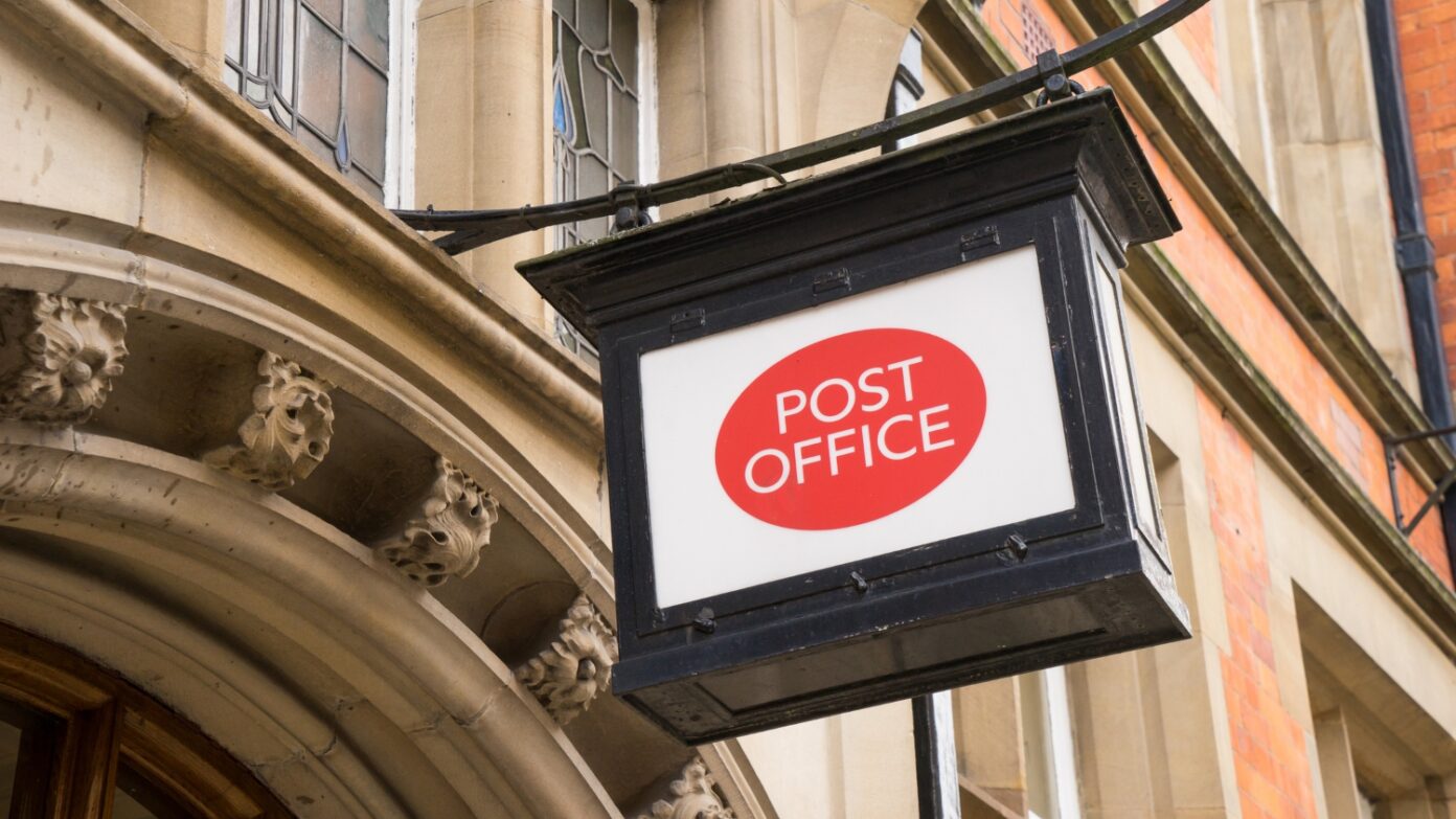 Post Office sign above an entranceway.