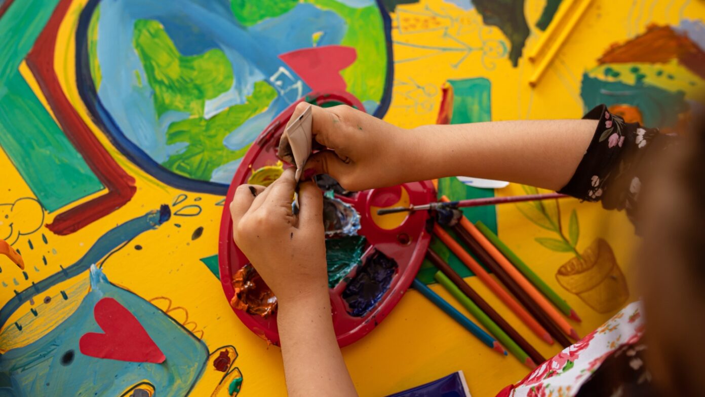 Children's hands with paints.